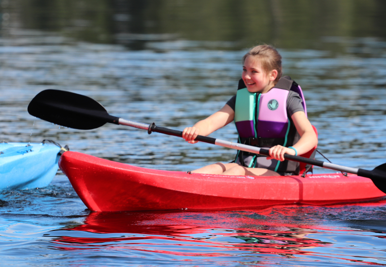 student in canoe rowing